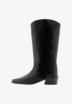 Black leather knee-high boots with a pointed toe and a stacked heel. Features fringe detailing along the back. Smooth texture with subtle stitching.