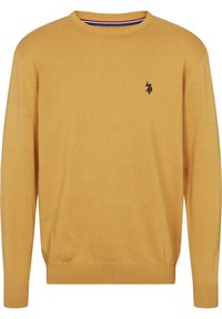 Senapsgul tröja, stickad textur, rundad halsringning, långa ärmar, ribbade cuffar och nederkant, liten svart broderad logotyp på bröstet.