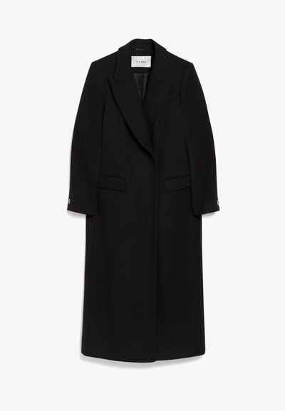 Schwarzer langer Wollmantel mit Reverskragen, doppelter Knopfleiste, stehenden Taschen und geknöpften Ärmeln.