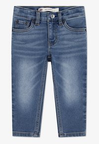 Közép kék farmernadrág egyenes szárú kivitelben, öt zsebbel, övhurkokkal, enyhe kopással és kontrasztos varrással.