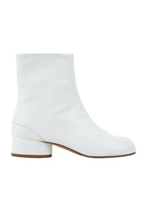 White leather ankle boot with a low block heel and round toe, shown in profile on a white background.