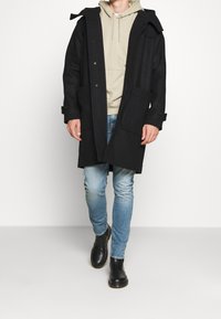 Nudie Jeans Klassisk kappa / rock - dark blue