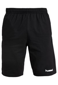 Shorts de sport noirs avec une ceinture élastique et un logo blanc "hummel" sur la partie inférieure de la jambe gauche.