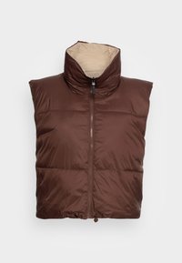 Brown, sleeveless puffer vest with a high collar, front zipper, padded sections, and a contrasting beige interior. Decorative drawstring at the hem.