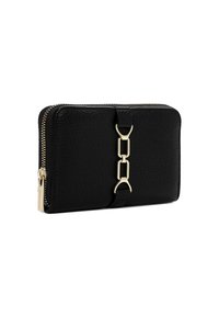 Black leather wallet with a textured finish, gold hardware accents, and a zip closure. Features a decorative strap with linked elements.
