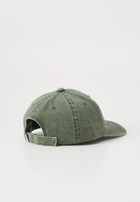 Olive green baseball cap with adjustable strap and metal buckle, displayed on a plain white background.