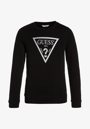 Sweat-shirt noir à manches longues avec logo GUESS U.S.A. en paillettes argentées, présentant un triangle et un point d'interrogation sur le devant.