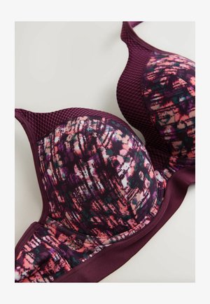 Formstøbt bh med en blanding af lilla, pink og sorte mønstre på et glat stof. Har mesh-detaljer og en solid lilla kant forneden.