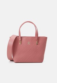 Pink leather handbag featuring a textured pattern, dual handles, and a removable shoulder strap, accented with gold hardware.