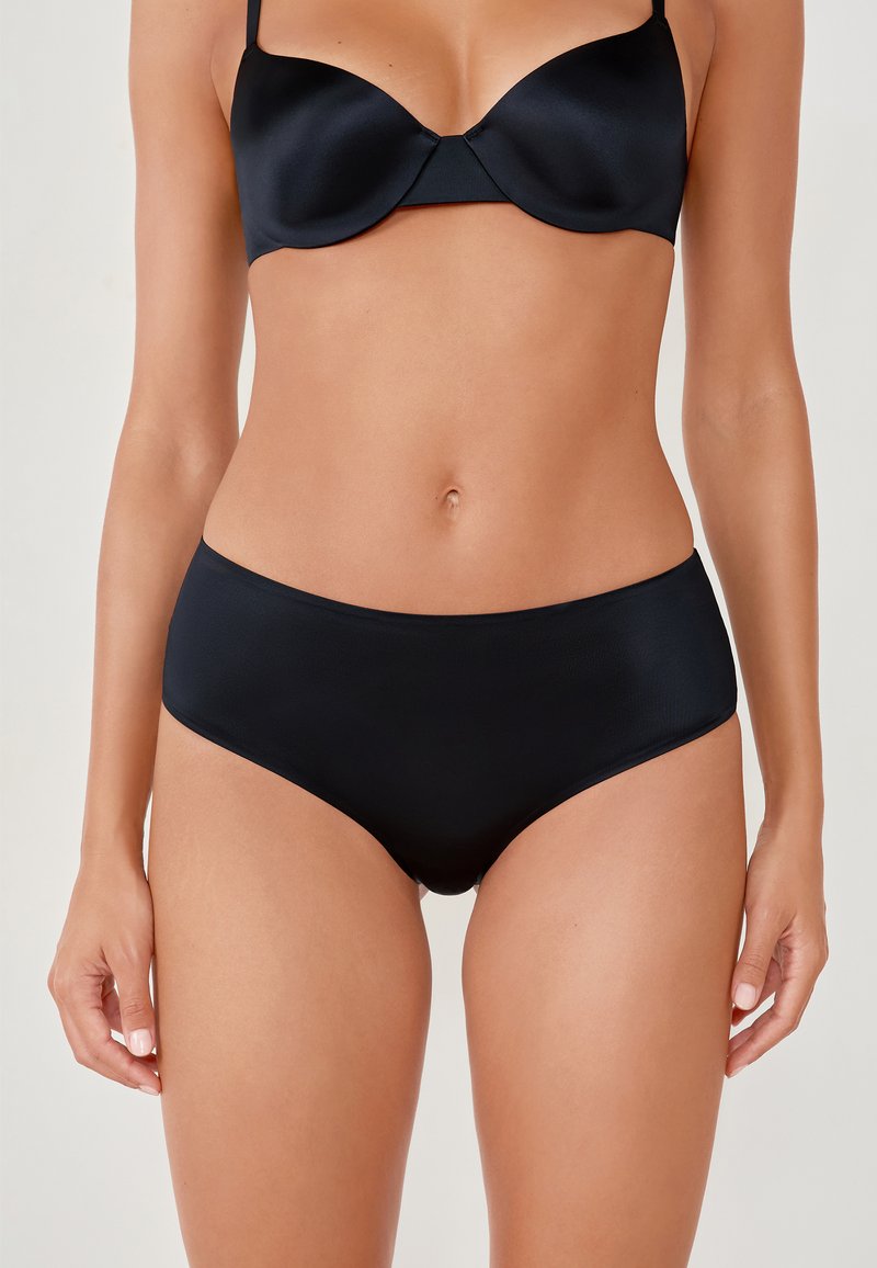 Black satin bra with molded cups and adjustable straps paired with high-waisted black panties, featuring a smooth texture and minimalist design.