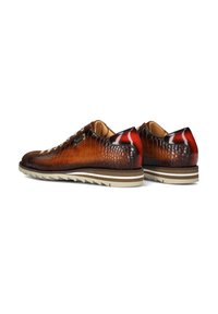 Brown crocodile-textured leather shoes with a rounded toe, lace-up design, tan lining, and a layered rubber sole featuring white and brown stripes.