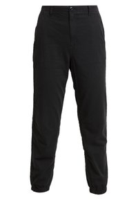 Pantalons noirs à coupe décontractée en mélange de coton doux. Dotés d'une fermeture à bouton, de poignets élastiques et de poches latérales pour plus de praticité.