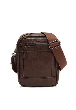 Compact dark brown leather crossbody bag with front zipper pocket and adjustable wide fabric shoulder strap.