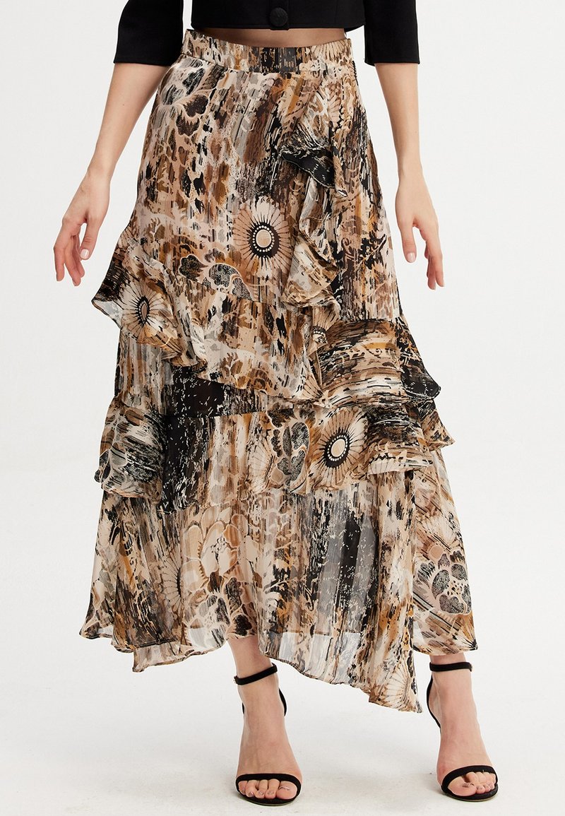 Jupe maxi fluide et à motifs en beige et noir, dotée de volants, de motifs floraux et d'un design superposé avec une texture transparente.