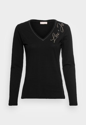 Schwarzes langärmliges T-Shirt mit V-Ausschnitt. Verfügt über ein strukturiertes Logo aus silbernen Rhinestones auf der linken Brust. Weicher Stoff, taillierte Passform.