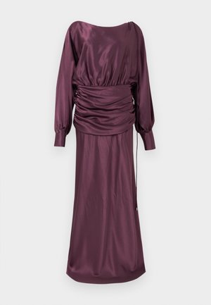 Μακρύ φόρεμα από σατέν δαμάσκηνο με λαιμόκοψη καραβοκύστου, μακριά φουσκωτά μανίκια, λεπτομέρεια ραβδώσεων στη μέση και εφαρμοστή φούστα που εκτείνεται μέχρι τους αστραγάλους.