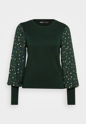 Green long-sleeve top with a textured body and puffed sleeves featuring scattered gold dot patterns. Round neckline and fitted cuffs.