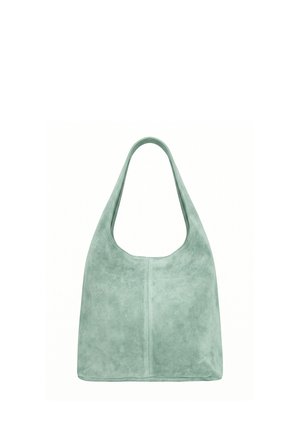 Sac à main en daim vert clair doux avec une large bandoulière unique et un design simple et épuré.