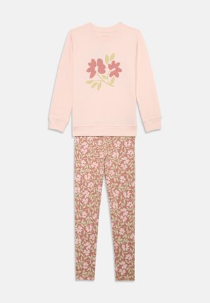 Light pink long-sleeve top with floral graphic paired with matching floral-patterned leggings in pink, beige, and green tones.