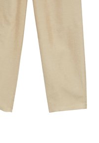 Pantalon beige droit avec des coutures visibles près des genoux et de l'ourlet, présenté sur fond blanc.
