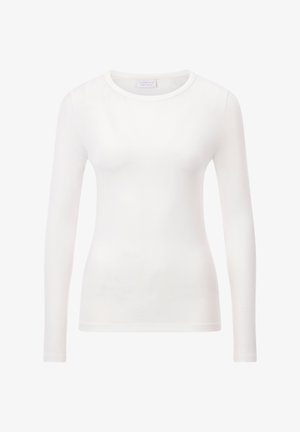 Ilga rankovė balta, prigludusi marškinėlių suapvalintu kaklu, pagaminta iš lygaus medvilnės. Tiesios rankovės ir minimalistiškas apdaila. Be raštų ar akcentų.