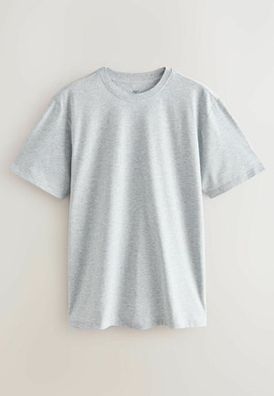 Siva bombažna majica s kratkimi rokavi, okroglega izreza in sproščenim krojem. Tkanina ima gladko teksturo in subtilen heather vzorec.