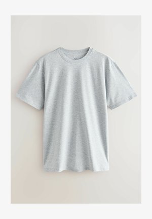 Siva bombažna majica s kratkimi rokavi, okroglega izreza in sproščenim krojem. Tkanina ima gladko teksturo in subtilen heather vzorec.