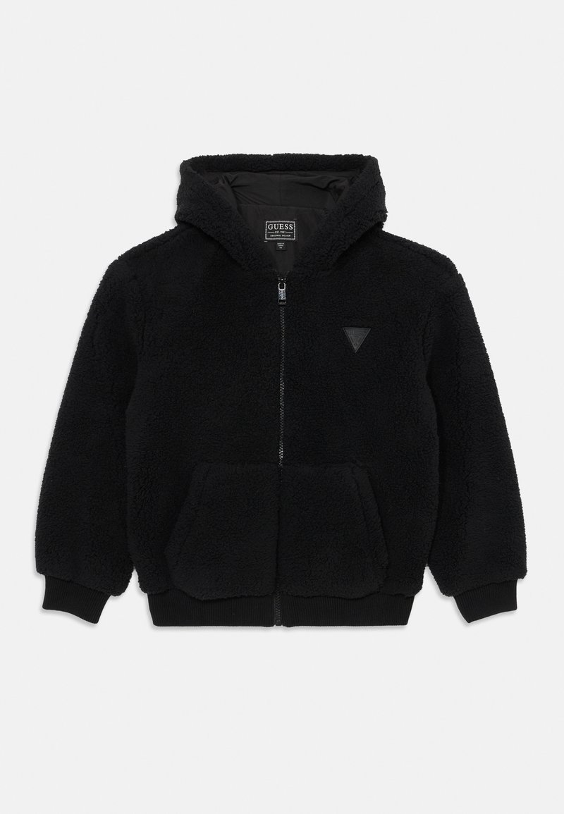 Sweat à capuche noir en polaire avec fermeture éclair, poches frontales, poignets et ourlet côtelés, et petit logo triangulaire sur la poitrine.
