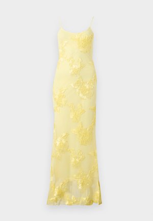 Robe nuisette jaune longue jusqu’au sol avec fines bretelles et détails d’appliques en dentelle florale sur toute la robe.