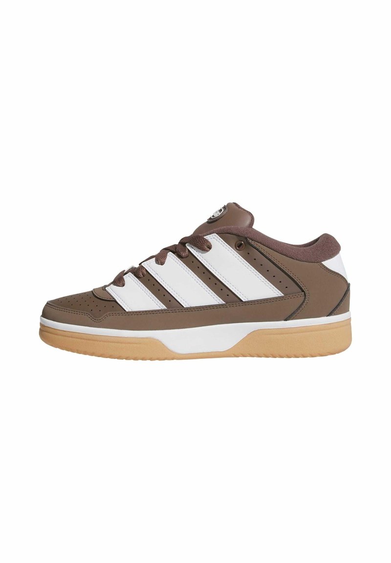 Brown sneakers with white stripes, a rubber sole, and perforated accents. Features a rounded toe and padded collar.