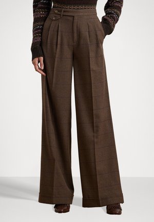 Brown plaid wide-leg pants with a high waist, featuring dual button accents and front pleats, made from textured wool blend fabric.
