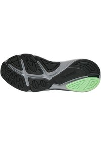 Svart och grå skosula med strukturerade gummimönster; grön accent nära hälen; logotyper präglade på ytan.