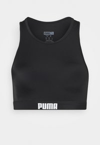 Fekete sportmelltartó sima, rugalmas anyagból. Kerek nyakkivágással és széles gumiszalaggal rendelkezik, rajta fehér "PUMA" logóval.