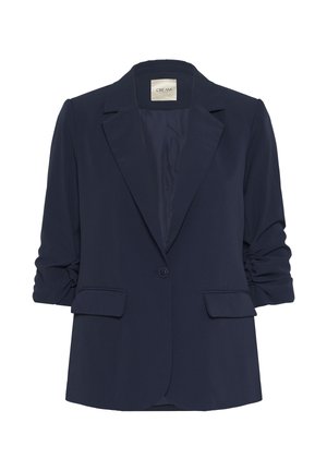 Navy zila blazer, izgatavots no mīksta auduma, ar vienu pogu, izvirzītiem lāpstiņiem un uzrullētām piedurknēm, kā arī divām priekšējām kabatām.