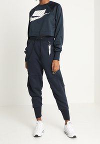 Nike Sportswear Teplákové kalhoty - dark blue