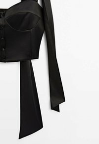 Black satin cropped top with a structured bodice, featuring decorative buttons and long, flowing straps on each side for adjustable fit.