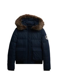 Mørkeblå pufferjakke med faux fur-bimser i hætten, rektangulært quiltet design, to forreste lommer, lynlåslukning og ribbede manchetter.