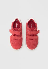 Red suede children's shoes with two Velcro straps, white accents, padded collar, and a textured mesh tongue for breathability.