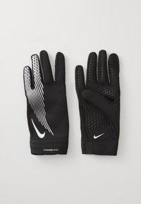 Sorte hansker laget av elastisk stoff, med et strukturert grep mønster på håndflaten, hvit Nike-logo og kontraststriper på baksiden.