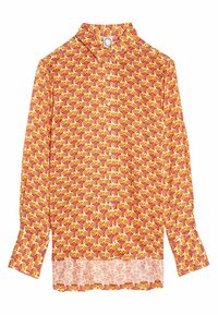 Chemise à manches longues avec un motif floral aux couleurs vives orange et jaune sur un fond rouge. Dotée d'un col à boutons et d'une finition droite.