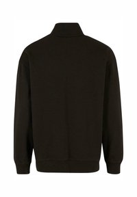 Black sweatshirt with a high collar, long sleeves, and ribbed cuffs. Soft fabric texture, simple design, and no visible logos or patterns.