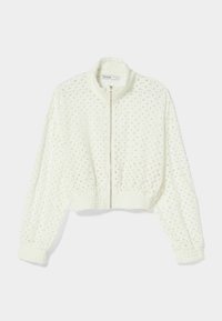 Cropped white jacket made of textured fabric, featuring a zip front and a high collar. Design includes openwork patterns and elastic cuffs.