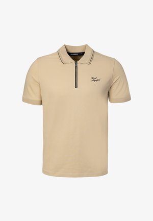 Polo beige manches courtes avec fermeture éclair à l'avant, bordure noire au col et petit logo noir script sur la poitrine gauche.