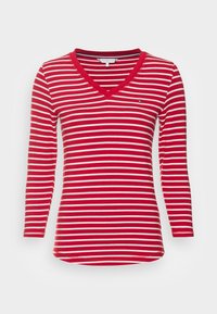 Punavalkoraidallinen, pitkähihainen V-kaula-aukollinen toppi, jossa on istuva malli. Vasemmassa rinnassa pieni logo ja pehmeä puuvillamateriaali.