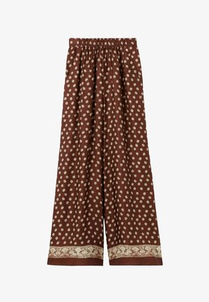 Pantalon large marron avec petit imprimé floral blanc et une bordure décorative florale blanche près de l'ourlet, doté d'une taille élastique.