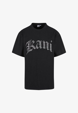 Must must ostukirjaga must särk, millel on suur, stiliseeritud valge lillemuster logo "Kani" rinnal ning klassikaline ümar kaelus.