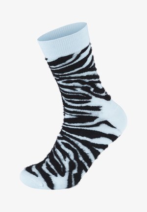 Blå, fluffy sokker med et svart og blått zebra-stripemønster, ribbet mansjett, myk tekstur og avrundet tå.