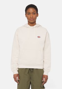 Felpa con cappuccio beige in cotone, con tasca frontale e logo ricamato sul petto. Polsini e orlo a coste.