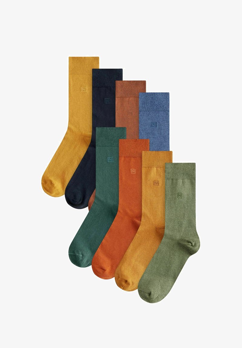 Osem par bombažnih nogavic v različnih barvah: gorčična rumena, temno mornarska, maroonska, svetlo modra, oranžna, zelena in olivna z rebrastimi robovi.