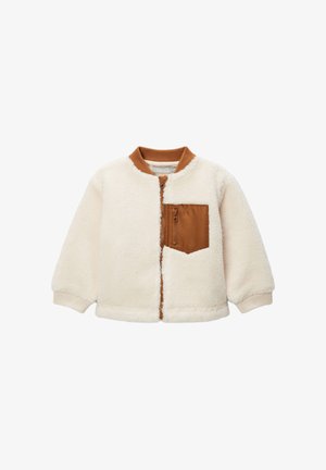 Veste en polaire, crème avec une poche en nylon marron, col rond, fermeture éclair avant, poignets élastiques et ourlet ; texture douce et design décontracté.